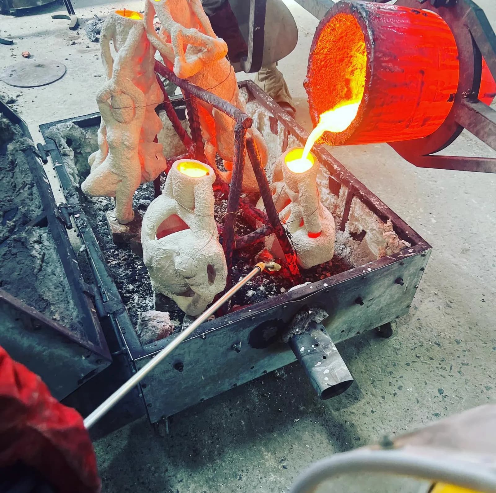 Molten bronze poured through the gating system